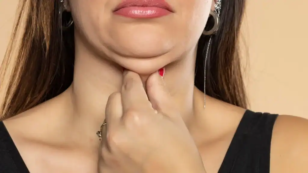 An image of a woman with double chin, sad, worried : Non Surgical Double Chin Removal Treatment in Northamptonshire, UK